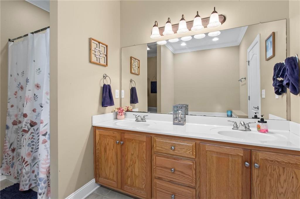 534 Hamilton Way, Unit 3 Chatsworth, GA 30705 - Photo 13 of 22 a bathroom with a double vanity sink mirror and double
