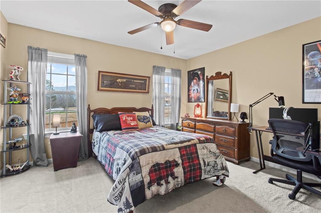 534 Hamilton Way, Unit 3 Chatsworth, GA 30705 - Photo 16 of 22 a bedroom with a bed and a chandelier