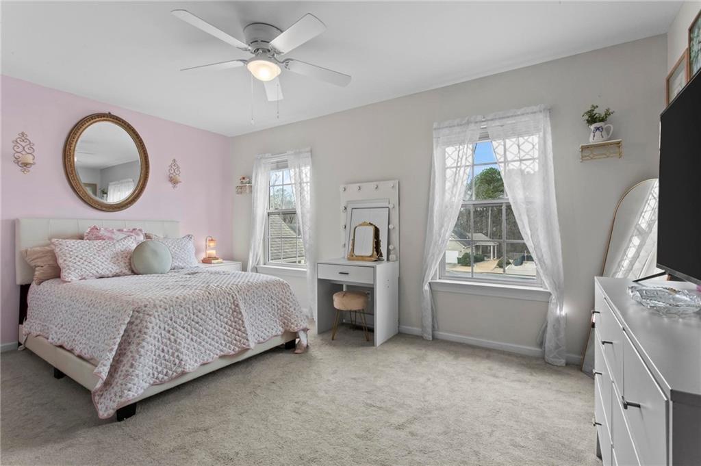 534 Hamilton Way, Unit 3 Chatsworth, GA 30705 - Photo 18 of 22 a bedroom with a bed and a chandelier