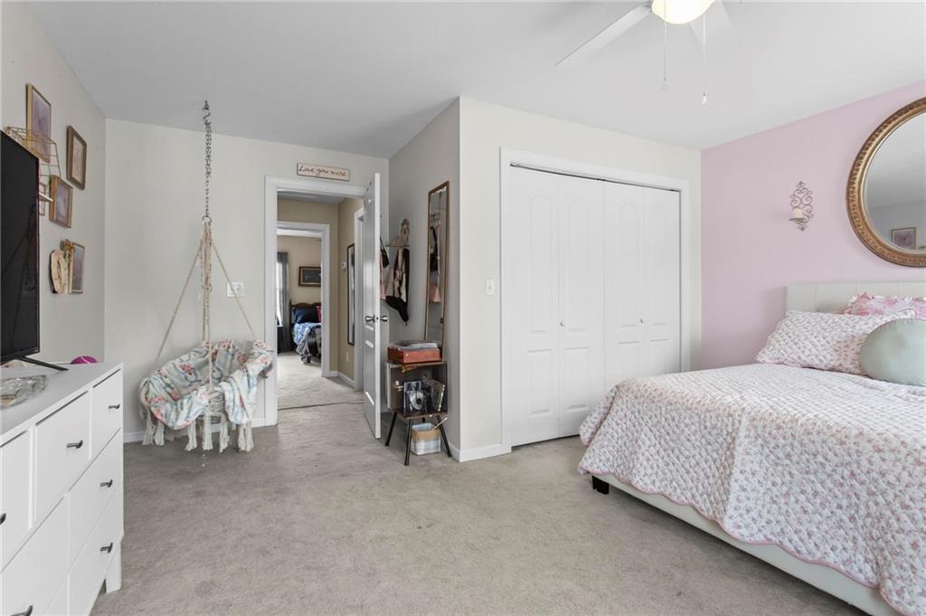 534 Hamilton Way, Unit 3 Chatsworth, GA 30705 - Photo 19 of 22 a bedroom with bed and a flat tv screen on dresser