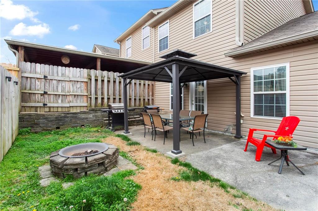 534 Hamilton Way, Unit 3 Chatsworth, GA 30705 - Photo 20 of 22 a view of a backyard with sitting area and furniture