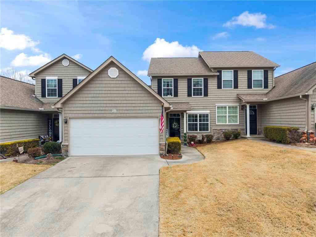 534 Hamilton Way, Unit 3 Chatsworth, GA 30705 - Photo 2 of 22 a view of a house with large space and a car parked in front of it