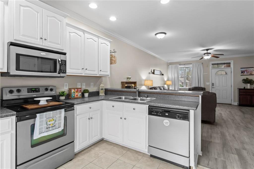 534 Hamilton Way, Unit 3 Chatsworth, GA 30705 - Photo 9 of 22 a kitchen with cabinets appliances a sink and a counter top space