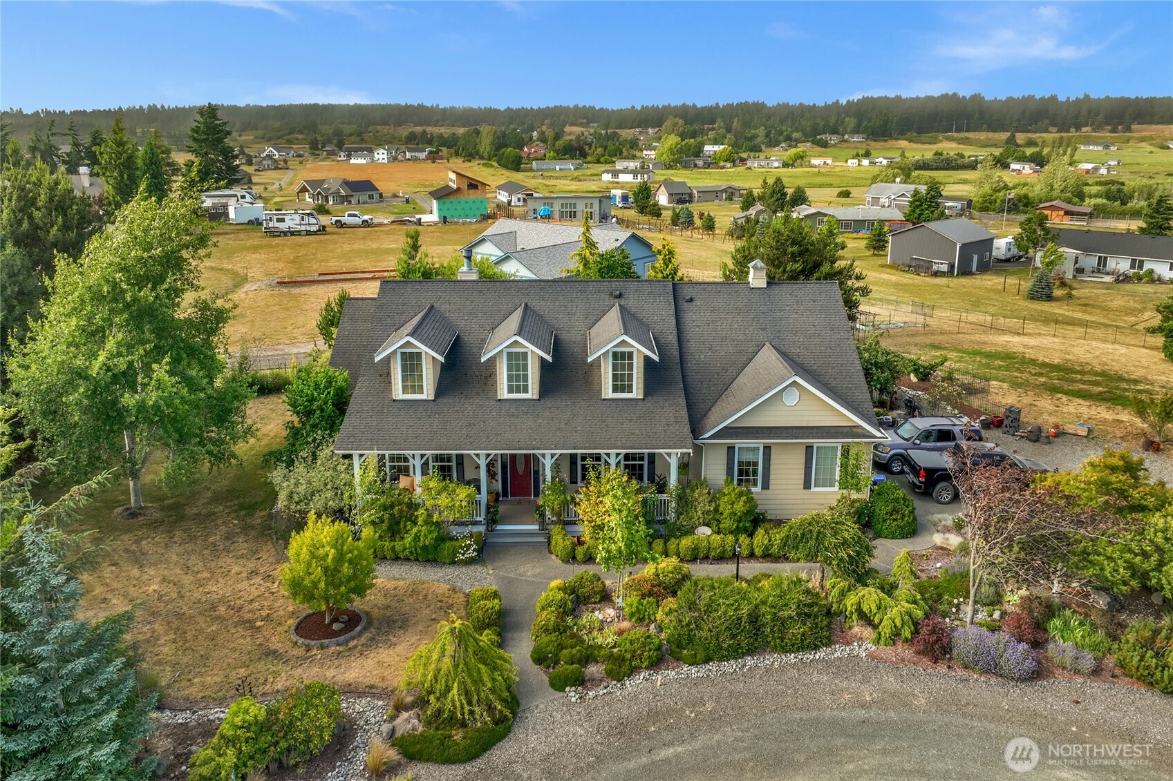 an aerial view of residential house with outdoor space and lake view