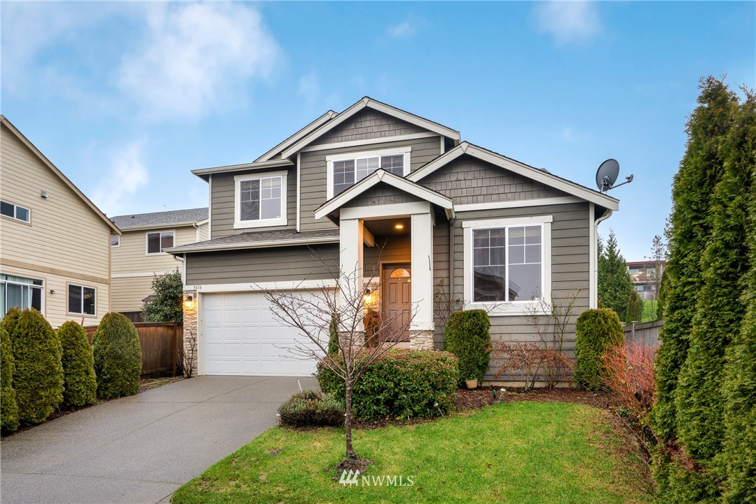 3616 Mill Place South Renton, WA 98055 - Photo 1 of 25 a front view of a house with garden