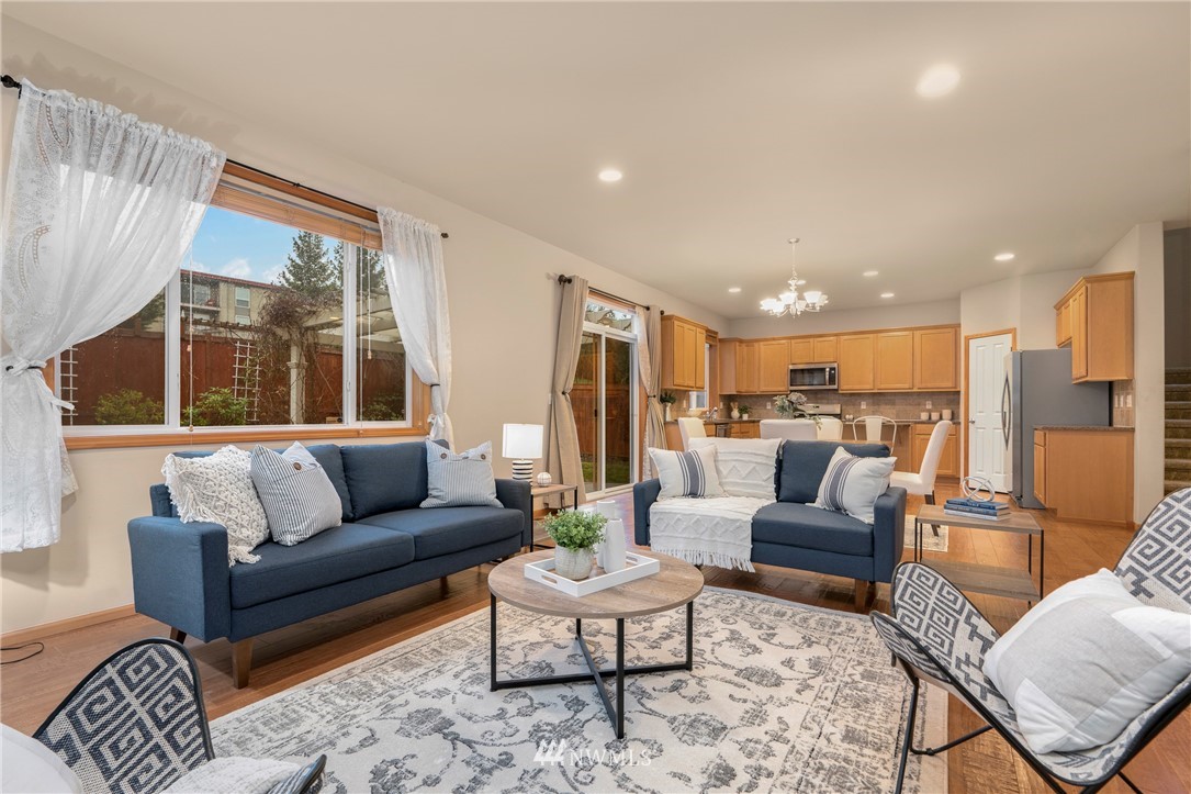 3616 Mill Place South Renton, WA 98055 - Photo 11 of 25 a living room with furniture and a large window