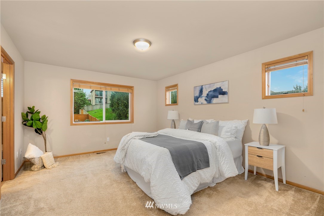 3616 Mill Place South Renton, WA 98055 - Photo 18 of 25 a bedroom with a bed and a window