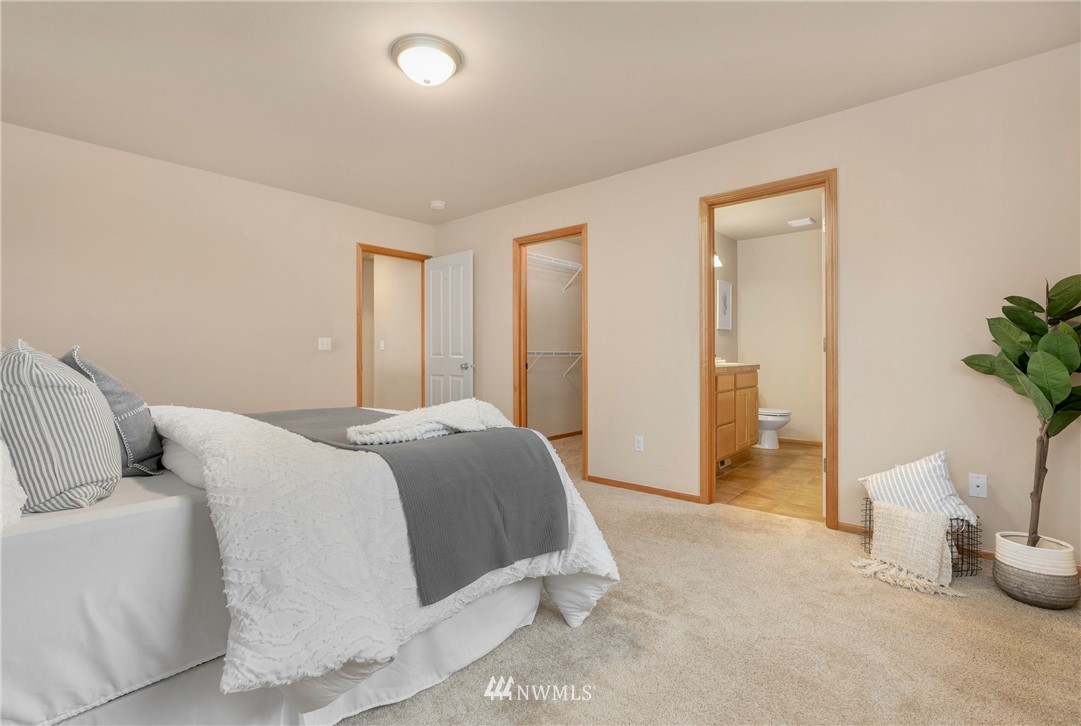 3616 Mill Place South Renton, WA 98055 - Photo 19 of 25 a bedroom with a bed and a potted plant
