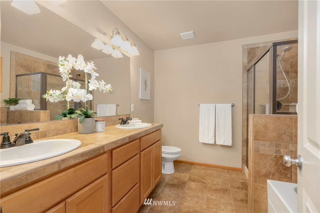 3616 Mill Place South Renton, WA 98055 - Photo 21 of 25 a bathroom with a double vanity sink mirror and toilet