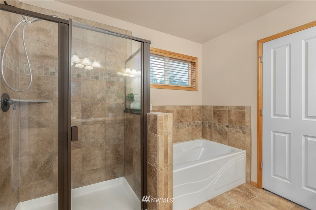 3616 Mill Place South Renton, WA 98055 - Photo 22 of 25 a bathroom with a bathtub and a shower