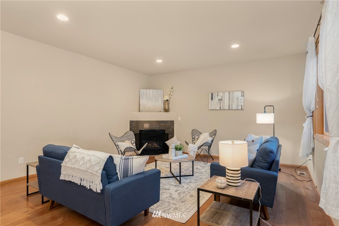 3616 Mill Place South Renton, WA 98055 - Photo 9 of 25 a living room with furniture and a fireplace