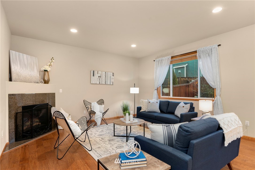 3616 Mill Place South Renton, WA 98055 - Photo 10 of 25 a living room with furniture and a fireplace