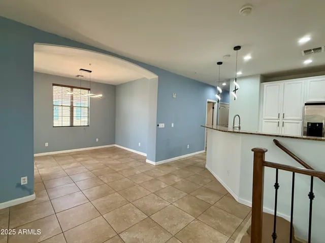 a view of a kitchen with a sink and a window