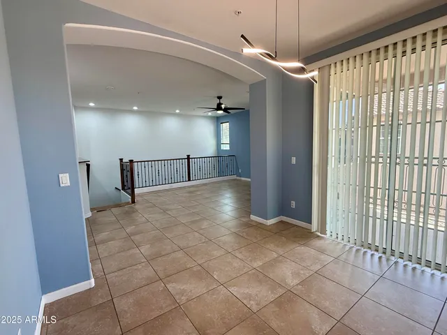 a view of a hallway with a chandelier