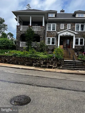 a view of a house with a bench