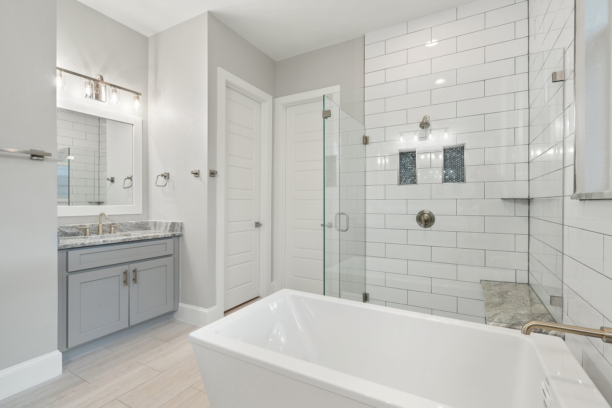 112 Axis Loop Georgetown, TX 78628 - Photo 25 of 39 a bathroom with a granite countertop sink a toilet and shower