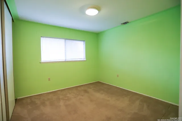 a view of a room that has a window