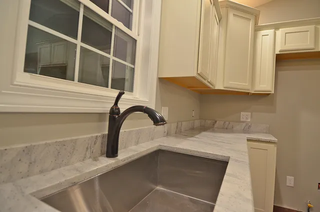 a close view of a sink and a vanity in a bathroom