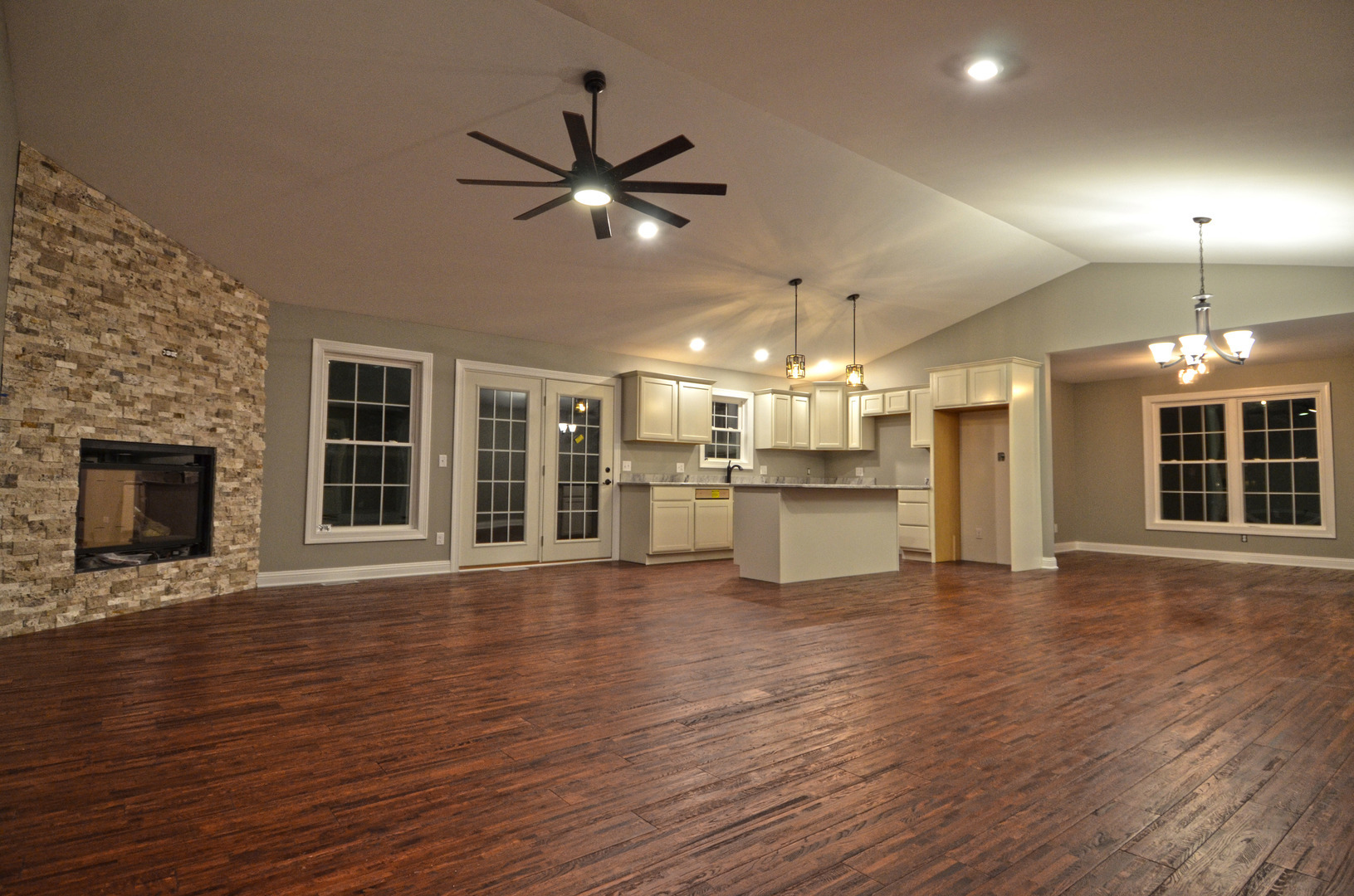 3290 East 289th Road LaSalle, IL 61301 - Photo 3 of 23 a view of an empty room with wooden floor and a kitchen