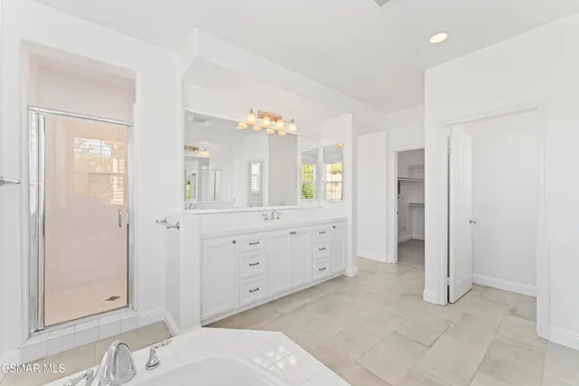 wooden floor with closet and mirror