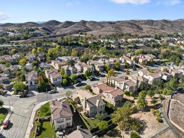 an aerial view of residential house and green space