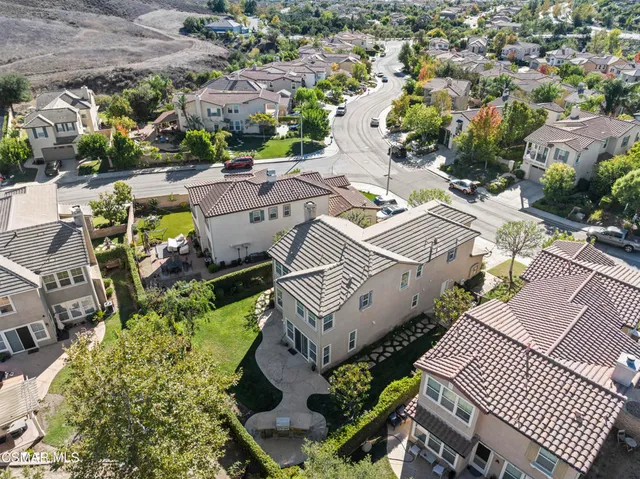 an aerial view of a house with outdoor space