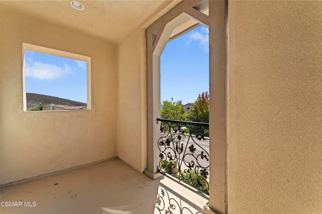 a view of a door and a window