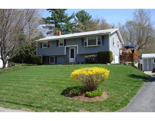 31 Cambridge Road Nashua, NH 03062 - Photo 1 of 11 a view of a house with a backyard