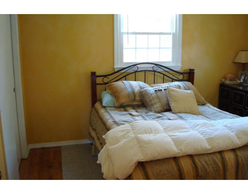 31 Cambridge Road Nashua, NH 03062 - Photo 5 of 11 a bedroom with a bed and teddy bear on bed