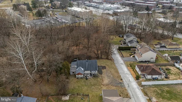 a view of multiple houses with yard