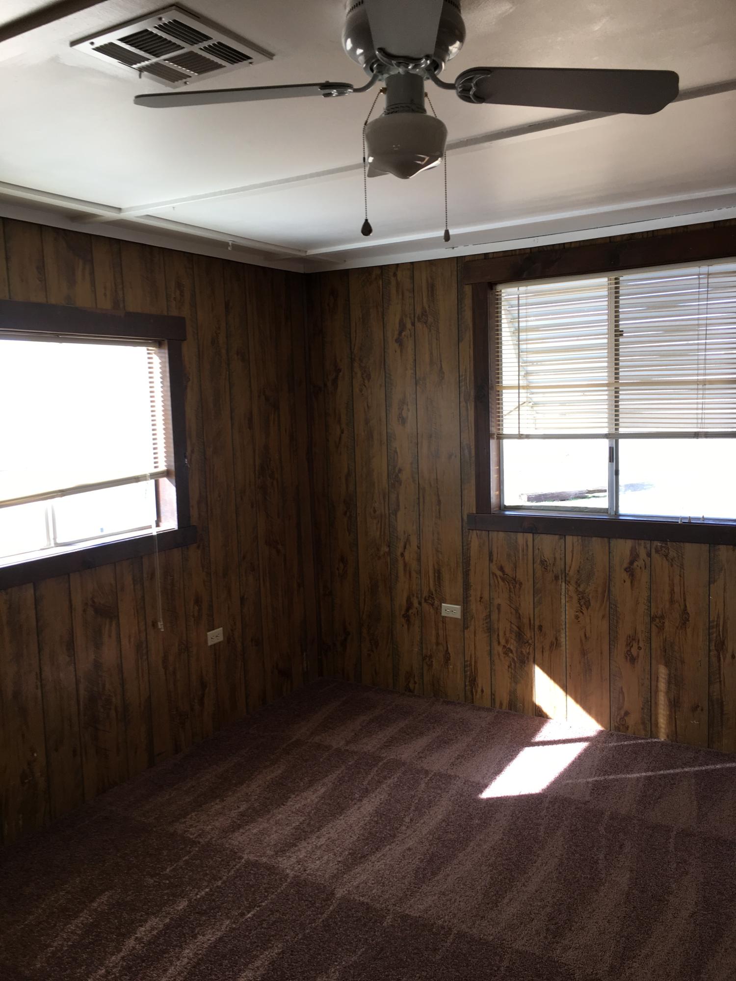 43254 52nd Street West Lancaster, CA 93536 - Photo 18 of 18 a room with a window and ceiling fan