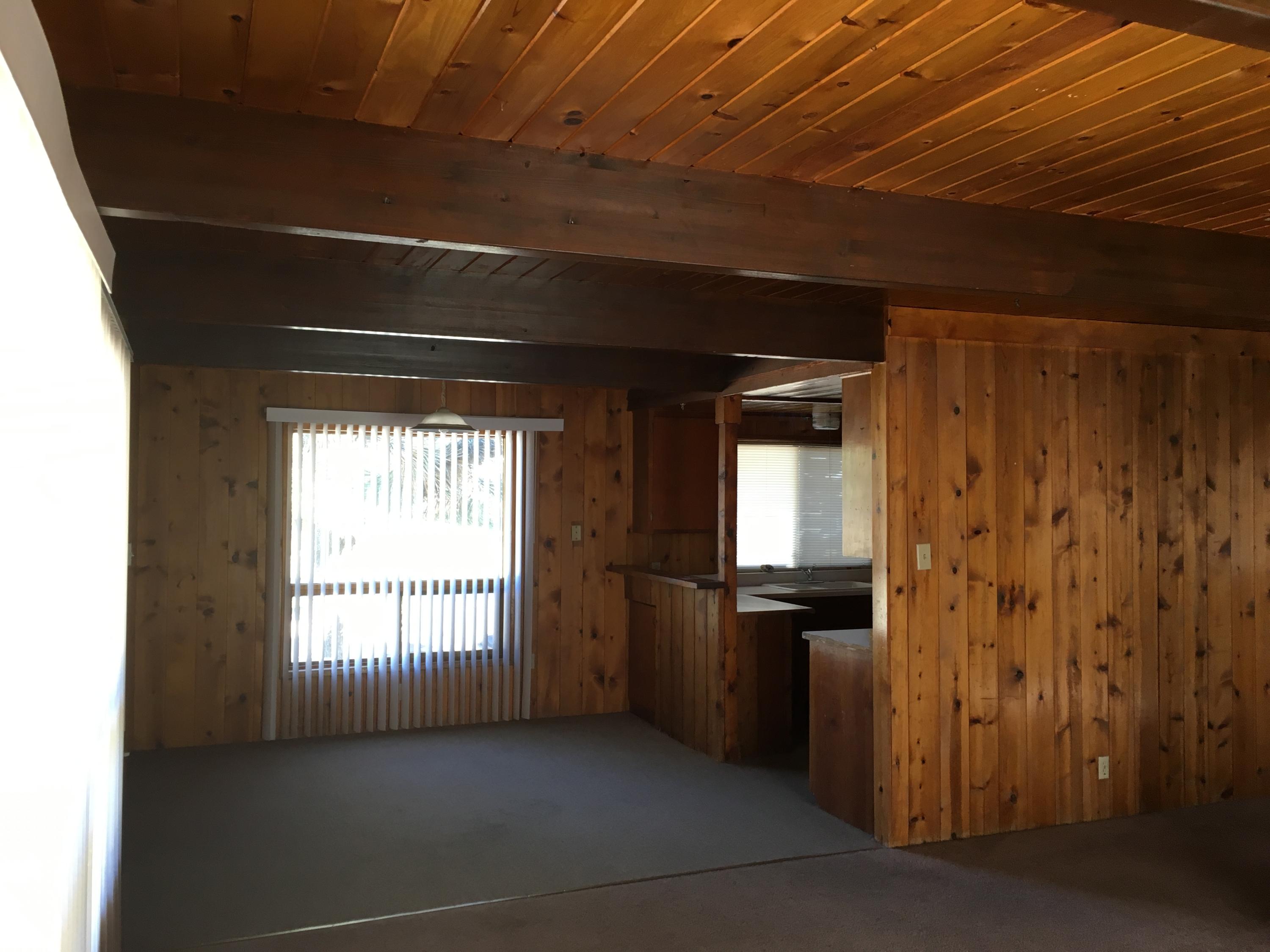 43254 52nd Street West Lancaster, CA 93536 - Photo 5 of 18 a view of an empty room with a window