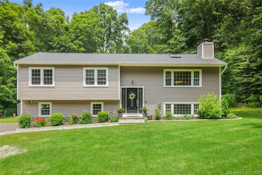 front view of a house with a yard