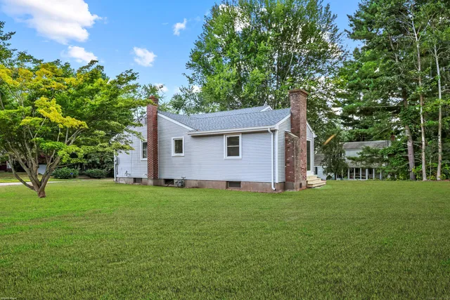 a backyard of a house with lots of green space