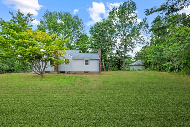a fire hydrant in the middle of a field