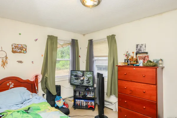 a room with a bed and a window