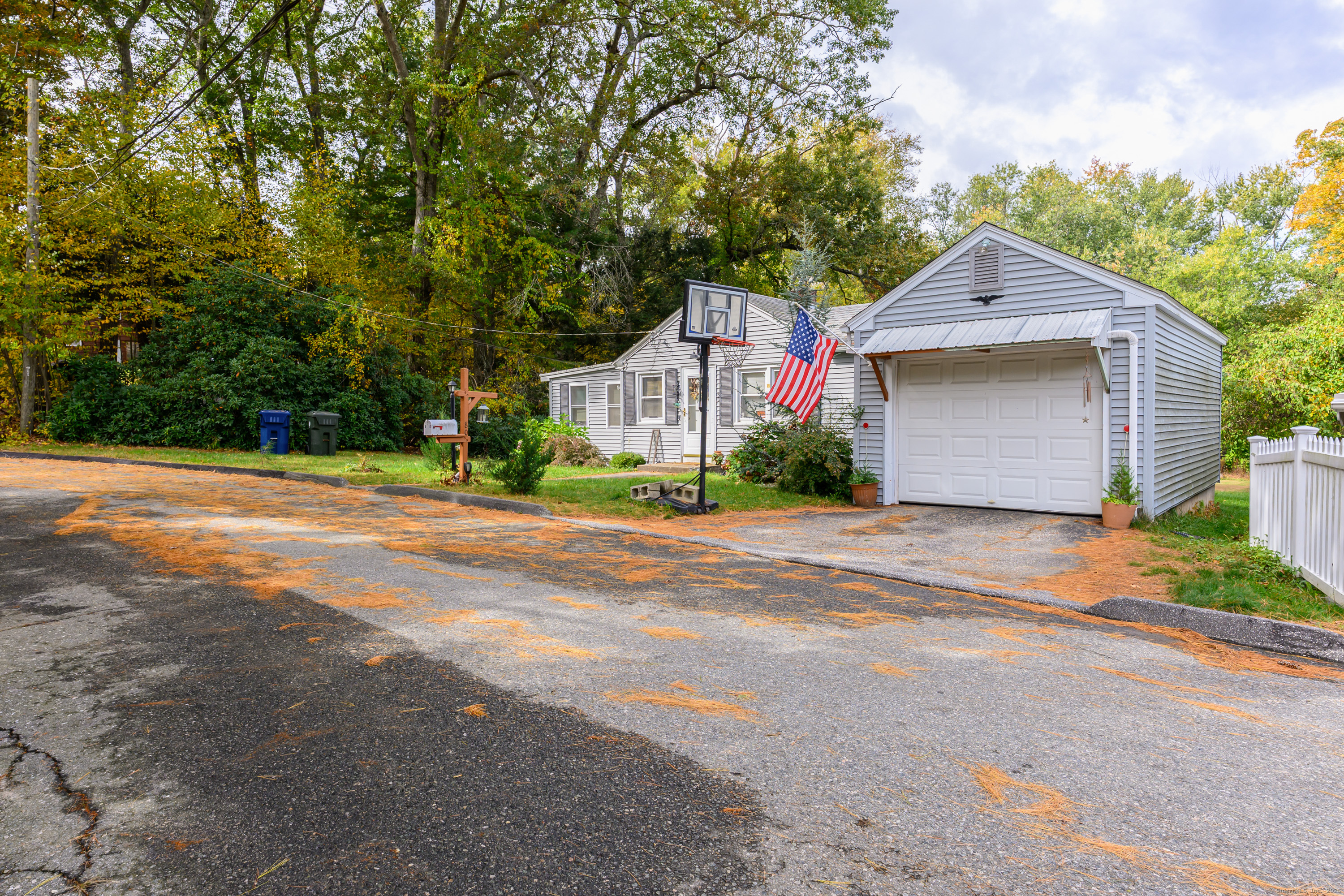 80 Old Plains Road Windham, CT 06226 - Photo 2 of 19 a front view of a house with a yard and garage