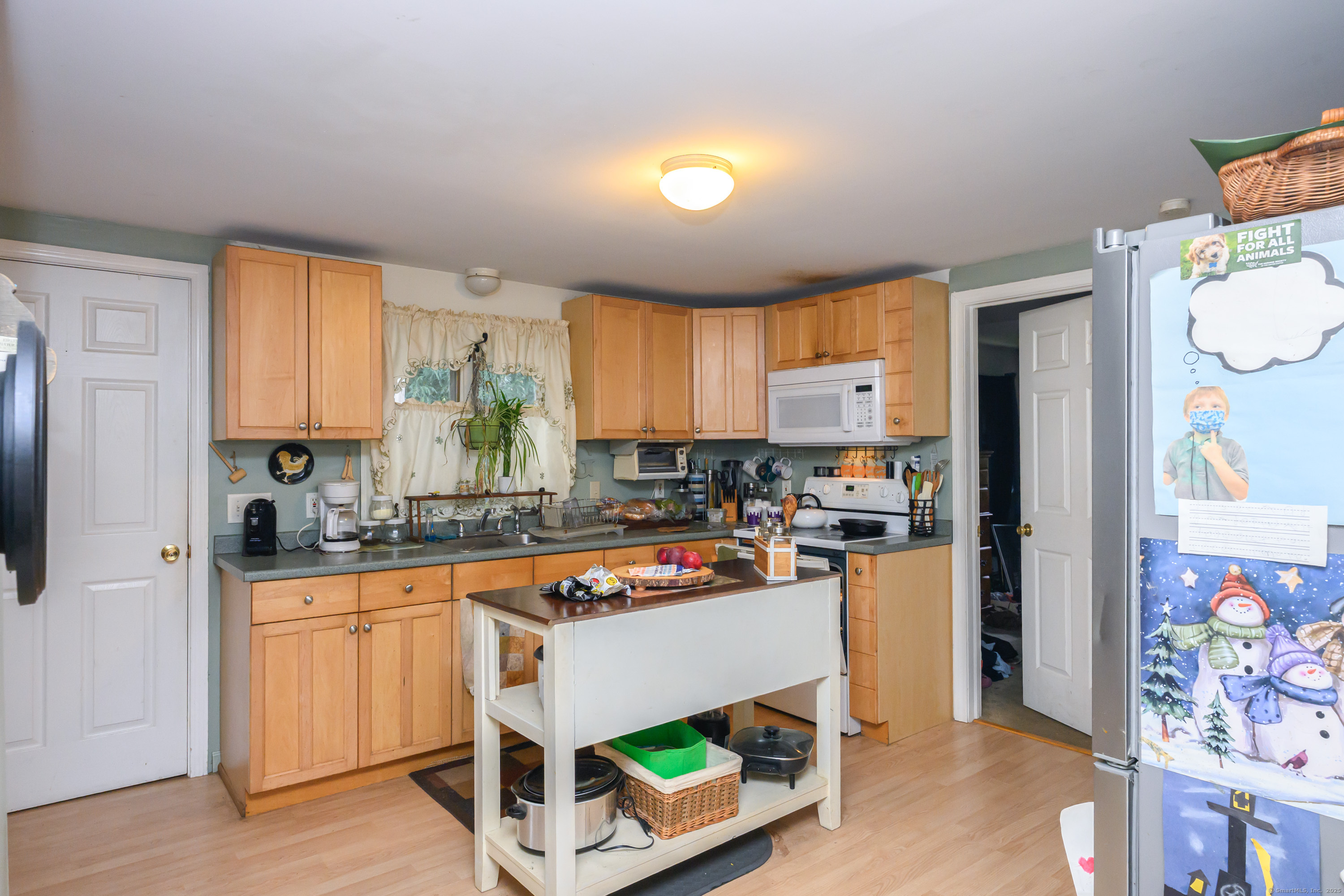 80 Old Plains Road Windham, CT 06226 - Photo 3 of 19 a kitchen with a refrigerator sink and wooden floor