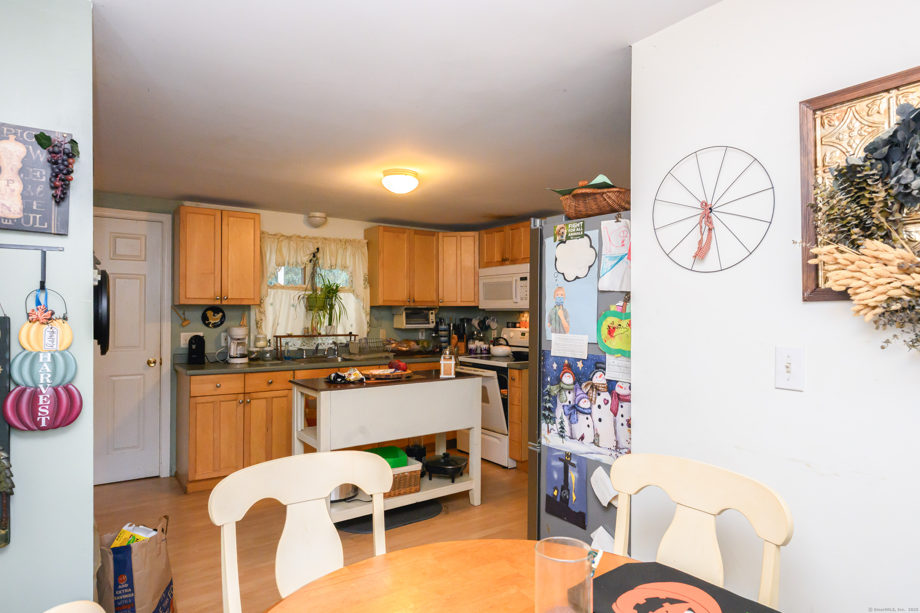 80 Old Plains Road Windham, CT 06226 - Photo 4 of 19 a kitchen with a refrigerator and a stove
