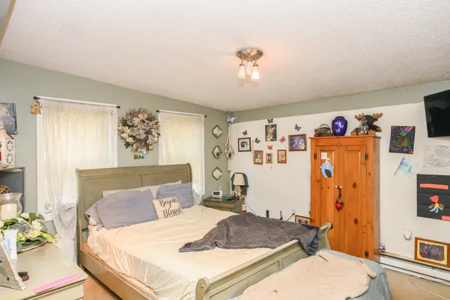 a bedroom with a bed and a table in it