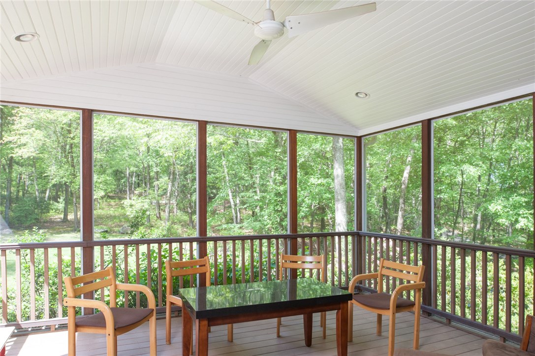 2097 Middle Road East Greenwich, RI 02818 - Photo 11 of 29 Spacious screened in porch with lighting, ceiling fan and composite decking and railings for easy maintenance.