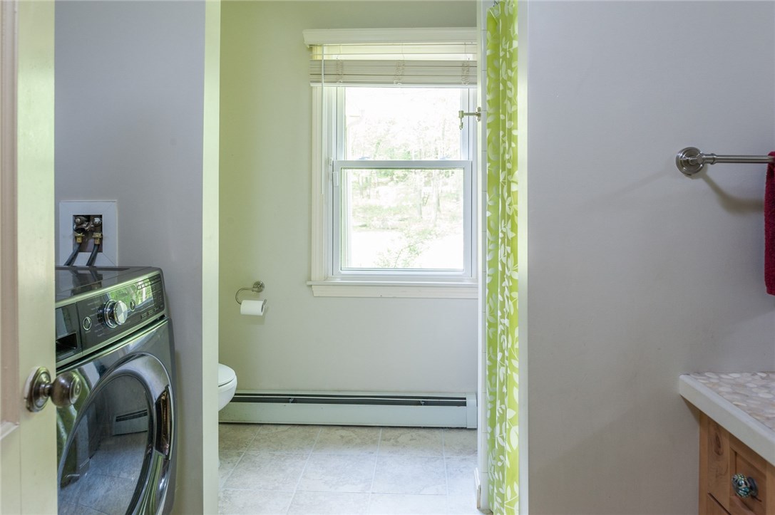2097 Middle Road East Greenwich, RI 02818 - Photo 16 of 29 The washing machine and dryer are being sold with the house and are conveniently located in the first floor full bathroom.