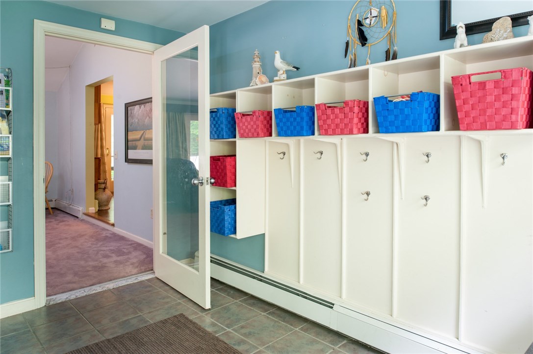2097 Middle Road East Greenwich, RI 02818 - Photo 2 of 29 The mud room has ceramic flooring so you don't have to worry about tracking snow or water in the main living area. Built in cubbies, hooks and a coat closet help to organize all of your coats, backpacks, boots, etc.