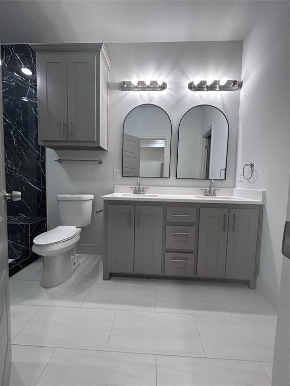 2110 Ridgewood Drive Bridgeport, TX 76426 - Photo 12 of 34 Full bathroom featuring double vanity and a shower