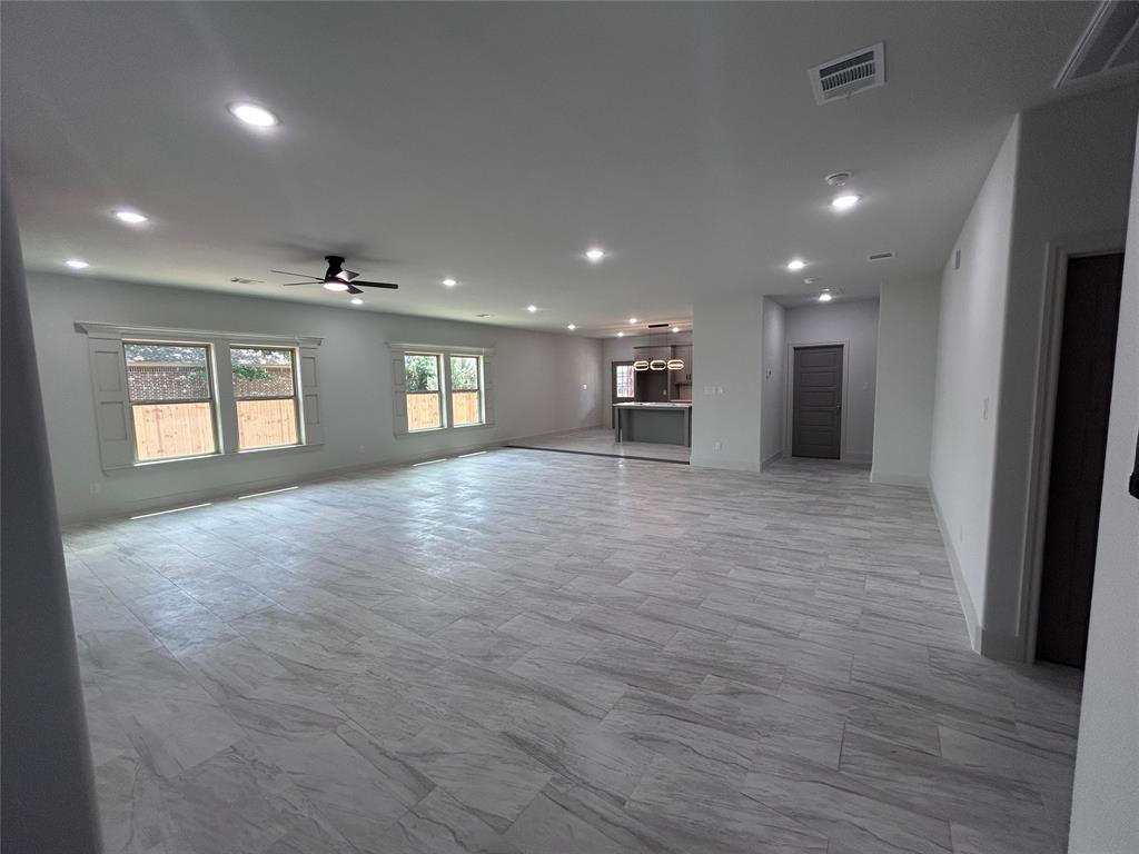 2110 Ridgewood Drive Bridgeport, TX 76426 - Photo 2 of 34 Unfurnished living room with ceiling fan and recessed lighting