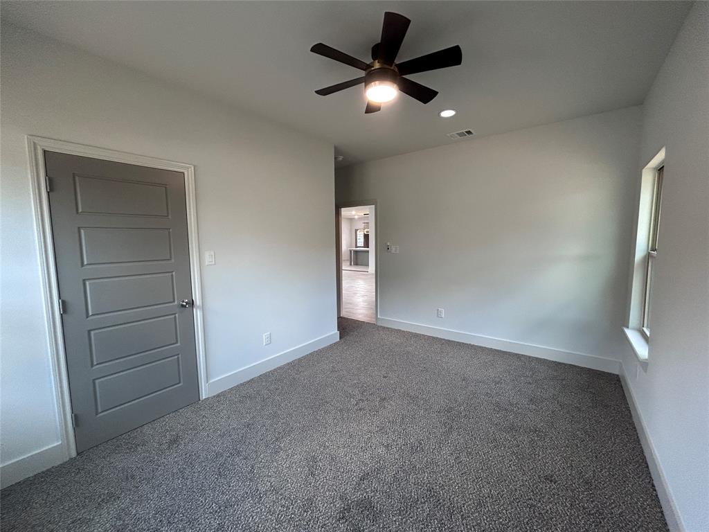 2110 Ridgewood Drive Bridgeport, TX 76426 - Photo 22 of 34 Unfurnished bedroom featuring carpet, a ceiling fan, and recessed lighting