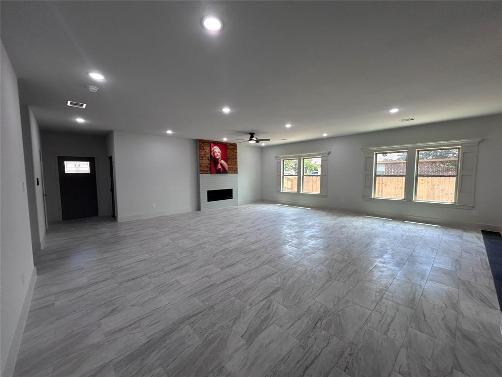 2110 Ridgewood Drive Bridgeport, TX 76426 - Photo 3 of 34 Unfurnished living room with recessed lighting, ceiling fan, and a fireplace