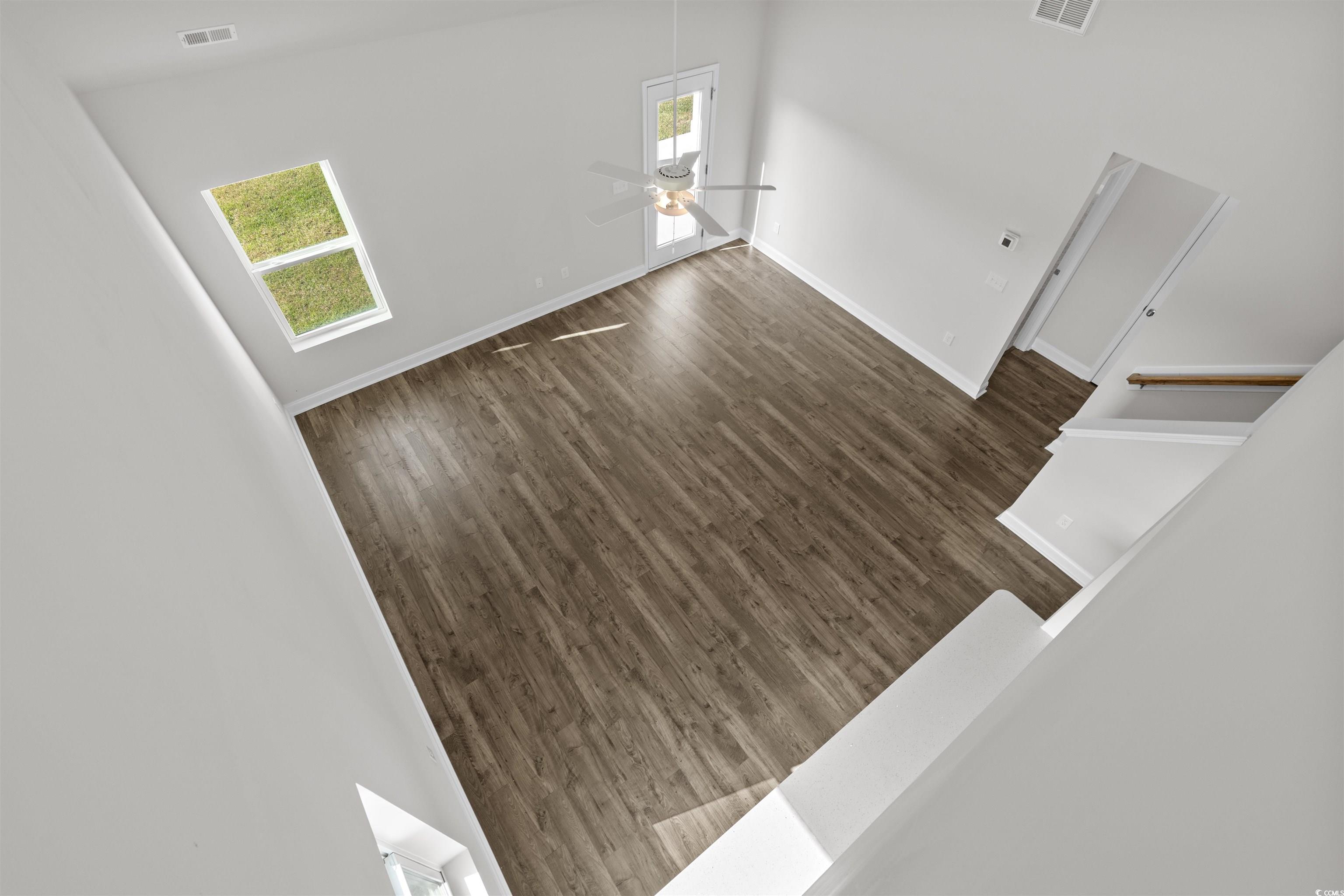 3013 Spain Lane Conway, SC 29527 - Photo 29 of 40 Unfurnished living room with healthy amount of natural light, a ceiling fan, and wood finished floors