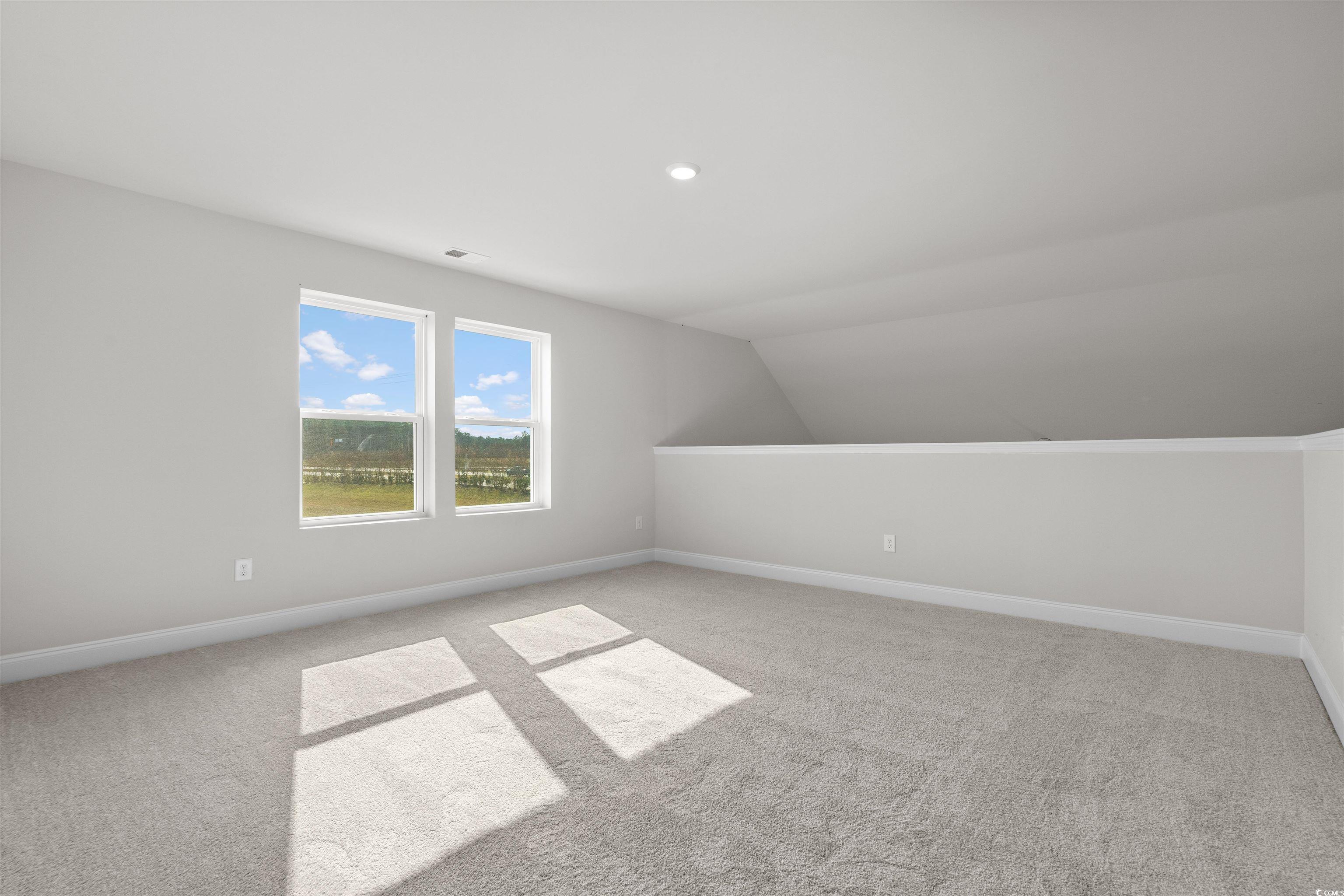 3013 Spain Lane Conway, SC 29527 - Photo 30 of 40 Bonus room with light colored carpet, vaulted ceiling, and recessed lighting