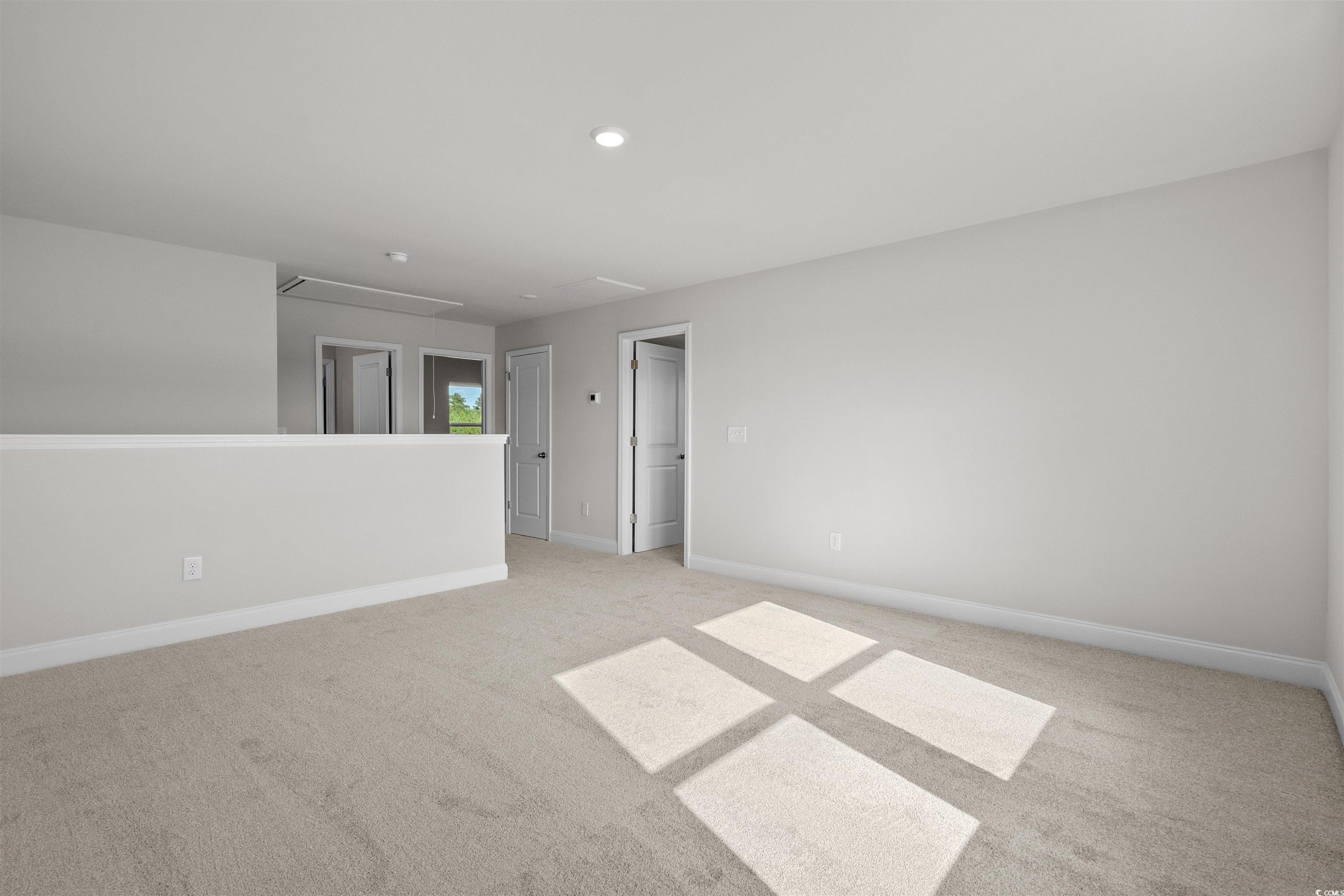 3013 Spain Lane Conway, SC 29527 - Photo 31 of 40 Spare room with attic access and light colored carpet